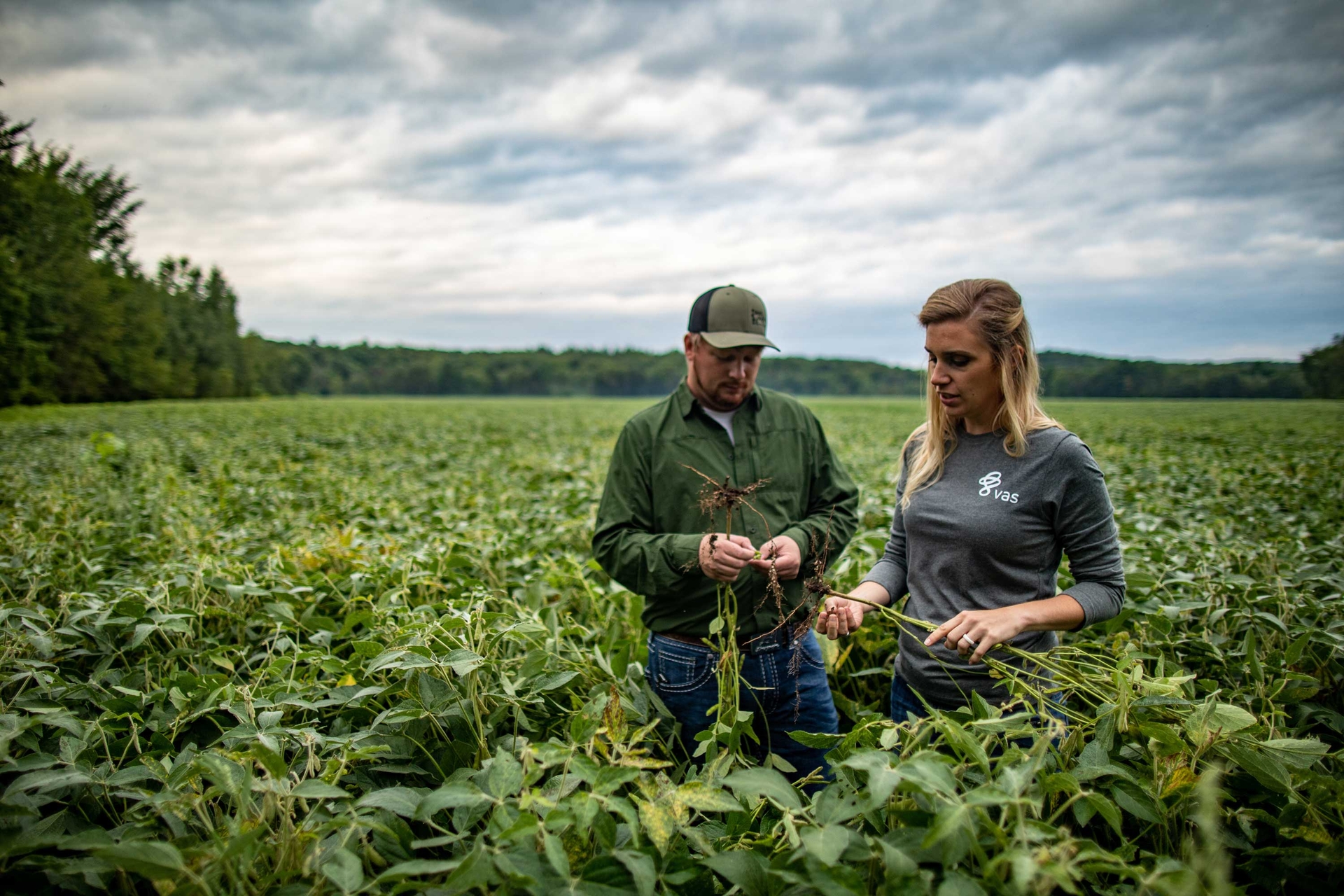 Man and Woman in Field Testing Soil and Plants